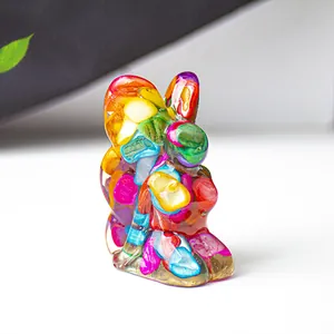 Close-up of a resin rabbit figurine with colorful crystal stone inlay and mosaic effect