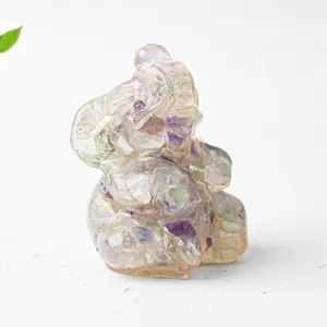 Detailed close-up of elephant resin ornament filled with natural purple crystal gravel