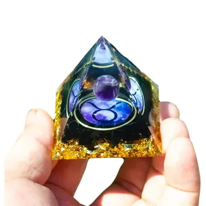 Orgone Pyramid with purple amethyst ball, Taurus sign, and golden metal flakes