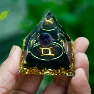 Handmade Gemini crystal pyramid with amethyst sphere and obsidian base stones