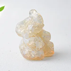 Macro detail of elephant resin figurine with natural crystal stone inlay and glossy finish