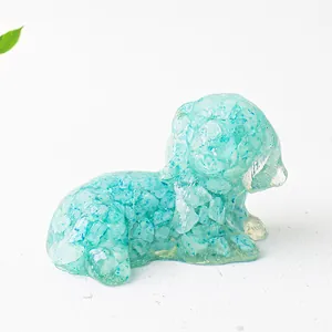 Top view of sitting dog figurine made of light blue resin with natural crystal stones
