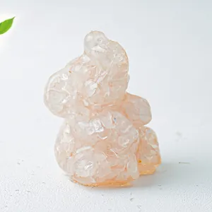 Detail view of pink crystal elephant figurine with resin texture and natural stones