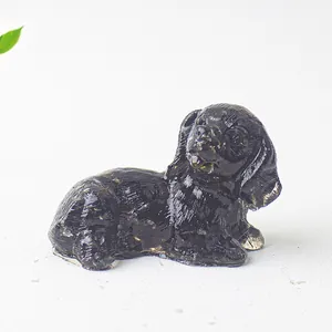Macro shot of a glossy black resin dog figurine for desktop and home decoration
