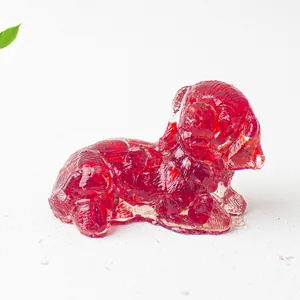 Close-up of a translucent red crystal dog figurine for home and office desktop decoration