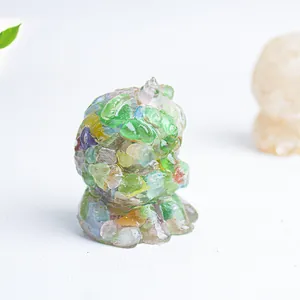Macro shot of translucent resin animal figurine with colorful natural crystal stones