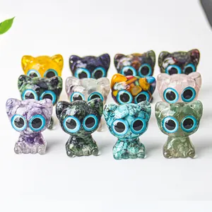 Macro shot of assorted natural crystal cat figurines with glossy finish and large eyes