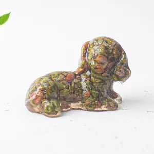 Detailed close-up of a dog ornament made from Unakite crystal chips and clear resin
