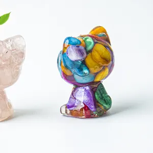 Detail of handmade resin cat figurine filled with colorful natural crystals and gemstones