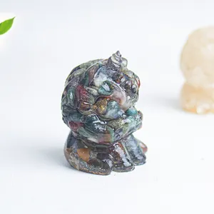 Macro shot of handmade resin animal figurine filled with colorful natural crystal stones