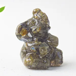 Detailed view of labradorite elephant statue with natural texture and blue-green flash
