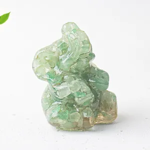 Close-up of green natural crystal stone resin elephant figurine for desk decor