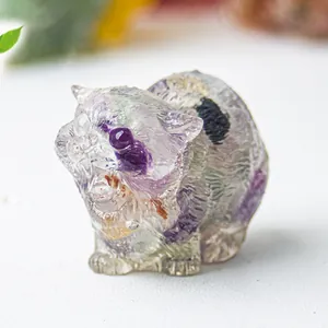 Macro shot of natural crystal cat figurine with purple fluorite texture and polished finish