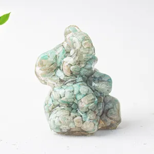 Detailed macro view of an elephant figurine crafted from natural green crystal stone and resin