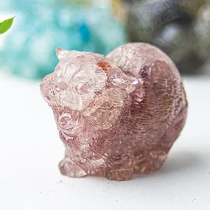 Detail of pink crystal resin cat statue showing intricate carved fur texture and features