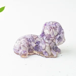 Detailed view of dog figurine with purple crystals in resin and gold foil bottom