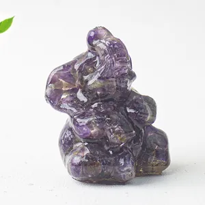 Macro view of purple amethyst elephant figurine showing natural crystal textures