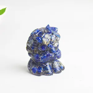 Detailed macro view of deep blue lapis lazuli resin lion statue with a white background