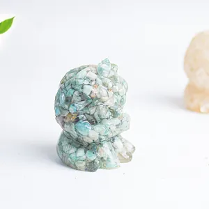 Detailed macro view of small light blue crystal stone resin cat ornament for desk decoration
