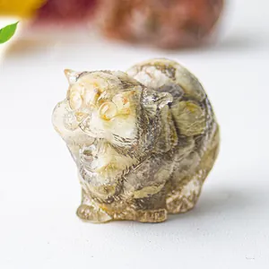 Macro detail of cat resin statue with natural crystal gravel inside for home decor