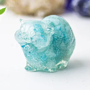 Detail of light blue translucent crystal resin cat ornament with fine fur texture