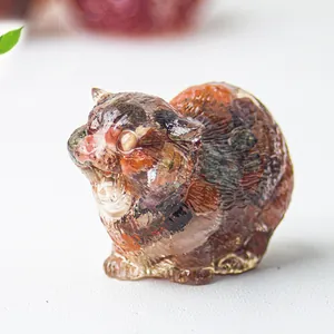Macro detail of cat figurine crafted with strawberry quartz resin in vibrant red tones