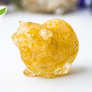 Detailed close-up of amber crystal cat figurine with intricate fur texture and warm resin finish