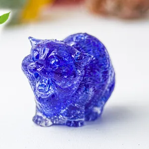 Close-up of a blue crystal resin cat figurine with a detailed roaring expression