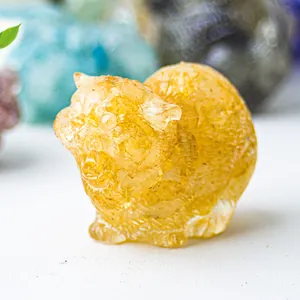 Macro shot of amber resin cat figurine showing translucent texture and fine crystal details