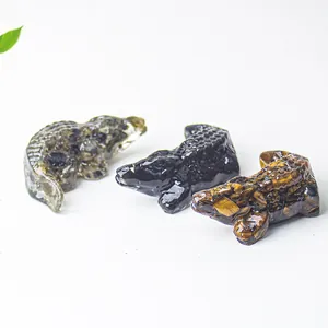 Macro shot of resin crocodile statues with natural crystal stone texture and details
