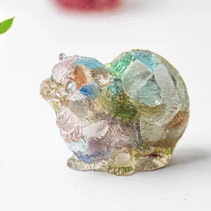 Macro shot of colorful resin animal figurine with crystal stones for desk decor