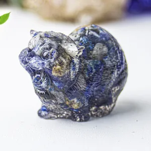 Macro shot of blue crystal resin cat figurine showing detailed angry facial expressions