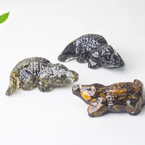 Macro detail of three resin crocodile figurines featuring natural crystal stone textures