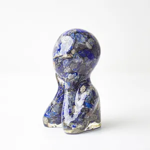 Macro view of thinker resin statue featuring embedded blue natural crystal stones