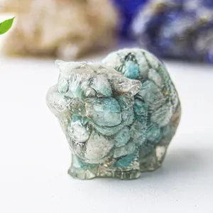 Macro view of a translucent resin cat figurine with green crystal stone textures