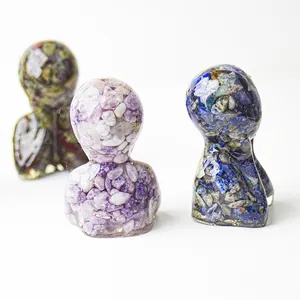Close-up of three human bust sculptures made of colorful natural crystals and resin