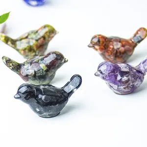 Detailed view of handmade crystal stone bird figurines with various natural textures