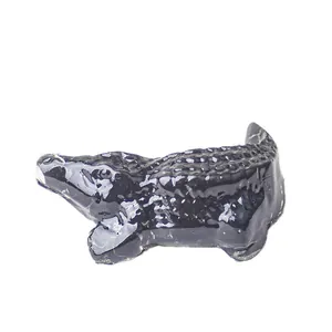 Polished black resin crocodile figurine with crystal stone detail for desktop decor