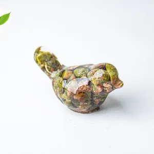 Detail shot of a bird statue crafted with resin and natural crystal stone chips