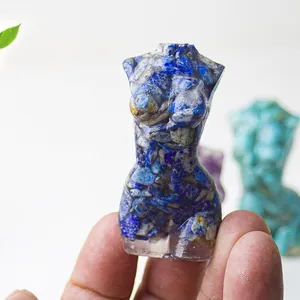 Close-up of female torso resin statue with embedded blue lapis lazuli crystals