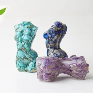 Detailed view of female body torso sculptures crafted with resin and natural crystals