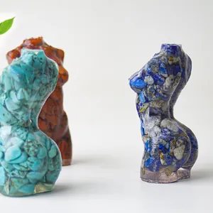 Artistic female body sculpture made of resin and natural crushed stone crystals