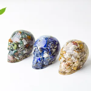 Three natural crystal resin skulls with mixed gemstones for desktop home decoration