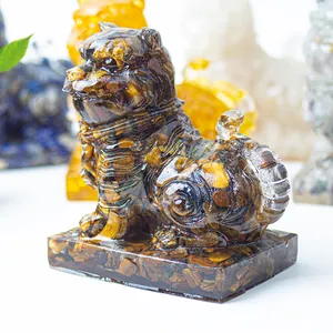Detailed close-up of a resin tiger statue filled with natural tiger eye stone chips