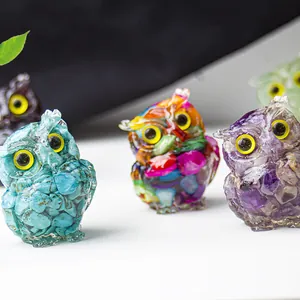 Macro shot of owl figurines crafted from resin and natural crystal quartz stones