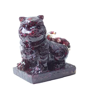 Deep red resin crystal tiger guardian statue with a polished finish and translucent texture