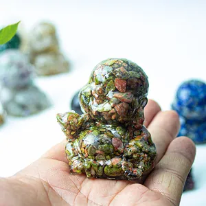 Handcrafted laughing Buddha resin ornament with embedded natural colorful crystals