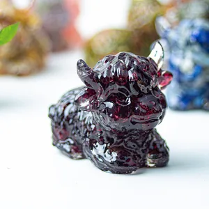 Macro shot of Highland Cow resin figurine with deep red crystal texture and polished finish