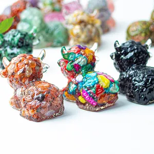 Macro detail of resin highland cow statues with natural crystals and colorful sequins