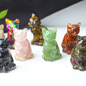 Detail of handcrafted resin lucky cat figurines made with natural crystal stone chips
